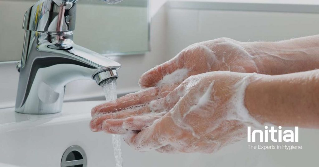 Image showing washing their hands at the bathroom sink
