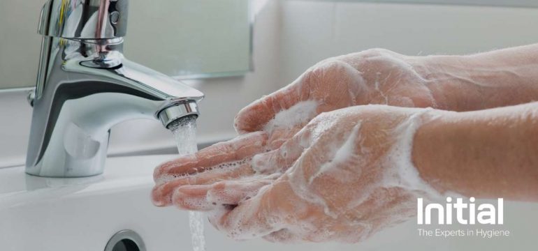 Image showing washing their hands at the bathroom sink